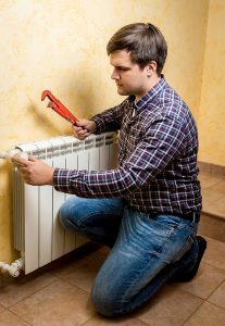 technician-working-on-radiator