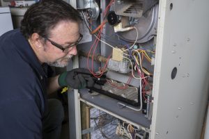 technician-giving-furnace-maintenance-tune-up