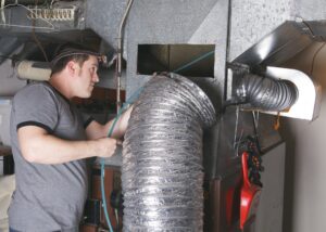 technician-fixing-furnace