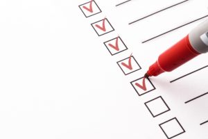 red-pen-checking-things-off-a-checklist